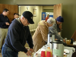 people helping themselves to refreshments