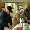 people helping themselves to refreshments